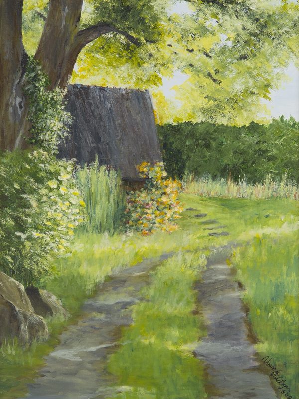 A thatched cottage beside a green lane on a bright summer day